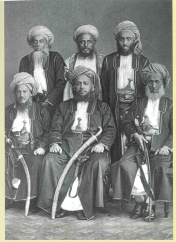 Sayyid Barghash Bin Sa’id, Sultan of Zanzibar (seated, centre), with Sir Tharia Topan (standing centre, back row)